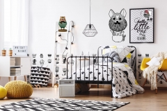 White wallpaper with black crosses in kid's bedroom with ladder, poster and yellow pouf